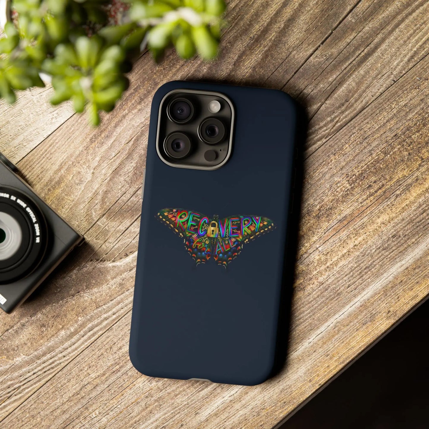 Phone case with recovery butterfly design on a wooden surface